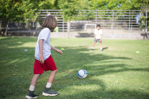 Child Playing Soccer